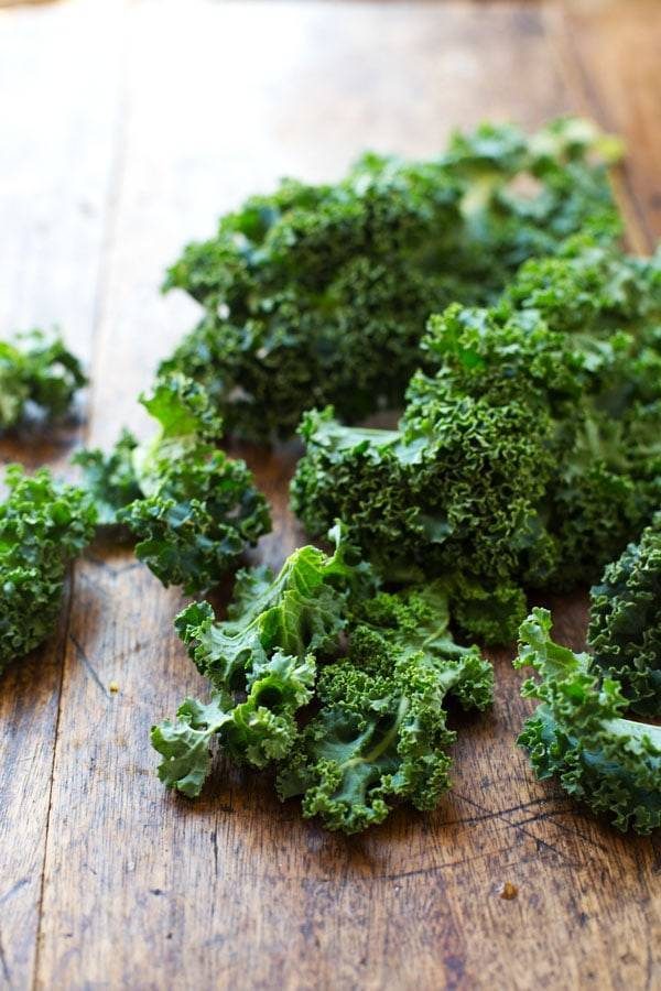 Kale on a wooden surface.