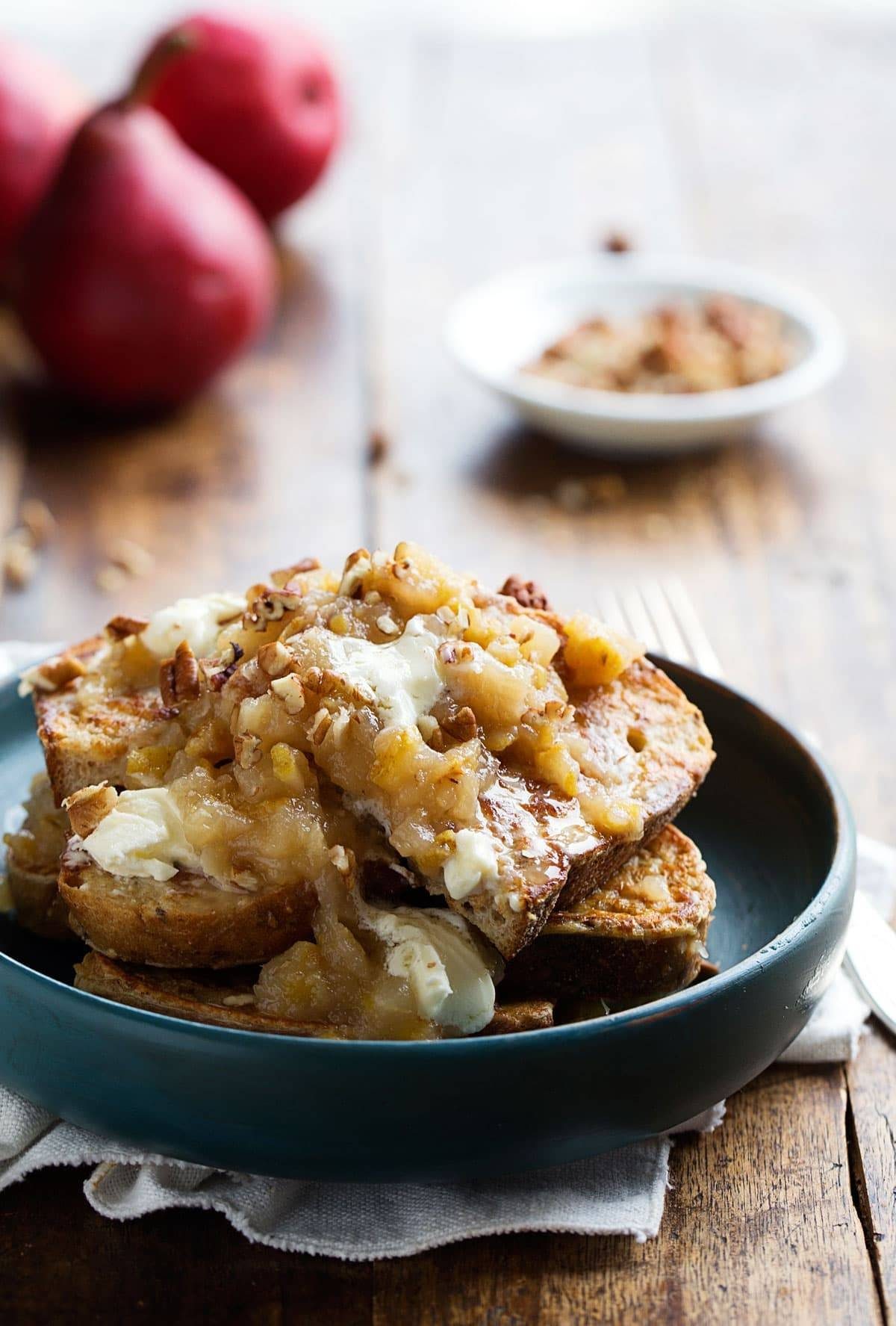 French Toast topped with Pear Chutney and Mascarpone on a dark blue plate.