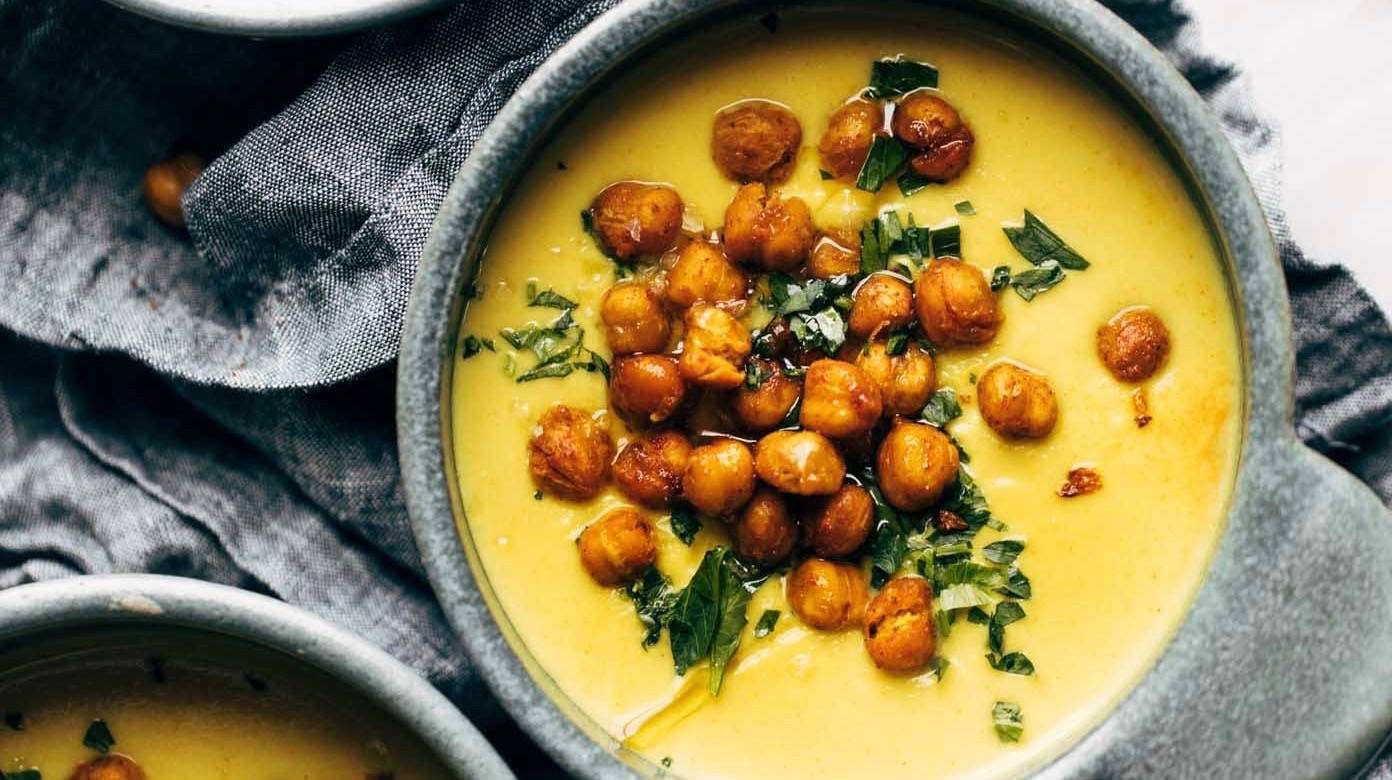 Golden Soup in bowls with chickpea topping.