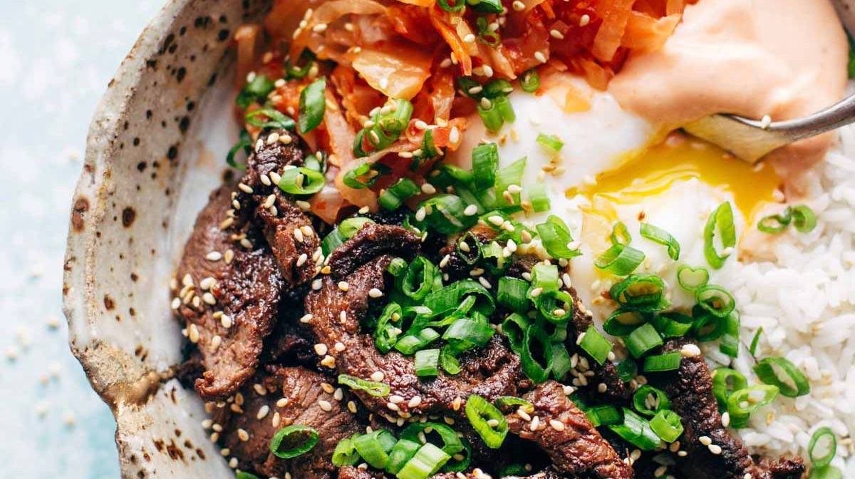Korean BBQ Yum Yum Rice Bowls in a bowl with fork.
