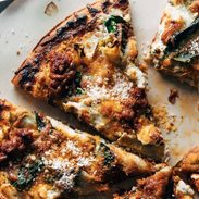 Slices of pizza sitting on a pizza pan.